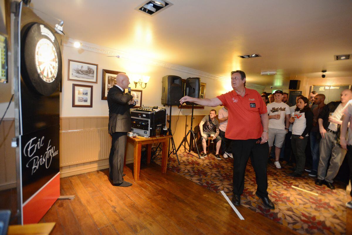 Playing darts to raise money for Lymphoma Trust is Eric Bristow MBE, at The Griffin, Dudley in 2014.