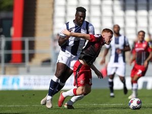Daryl Dike of West Bromwich Albion and Arthur Read of Stevenage at The Lamex Stadium on July 9, 2022 in Stevenage, England. (Photo by Adam Fradgley/West Bromwich Albion FC via Getty Images).