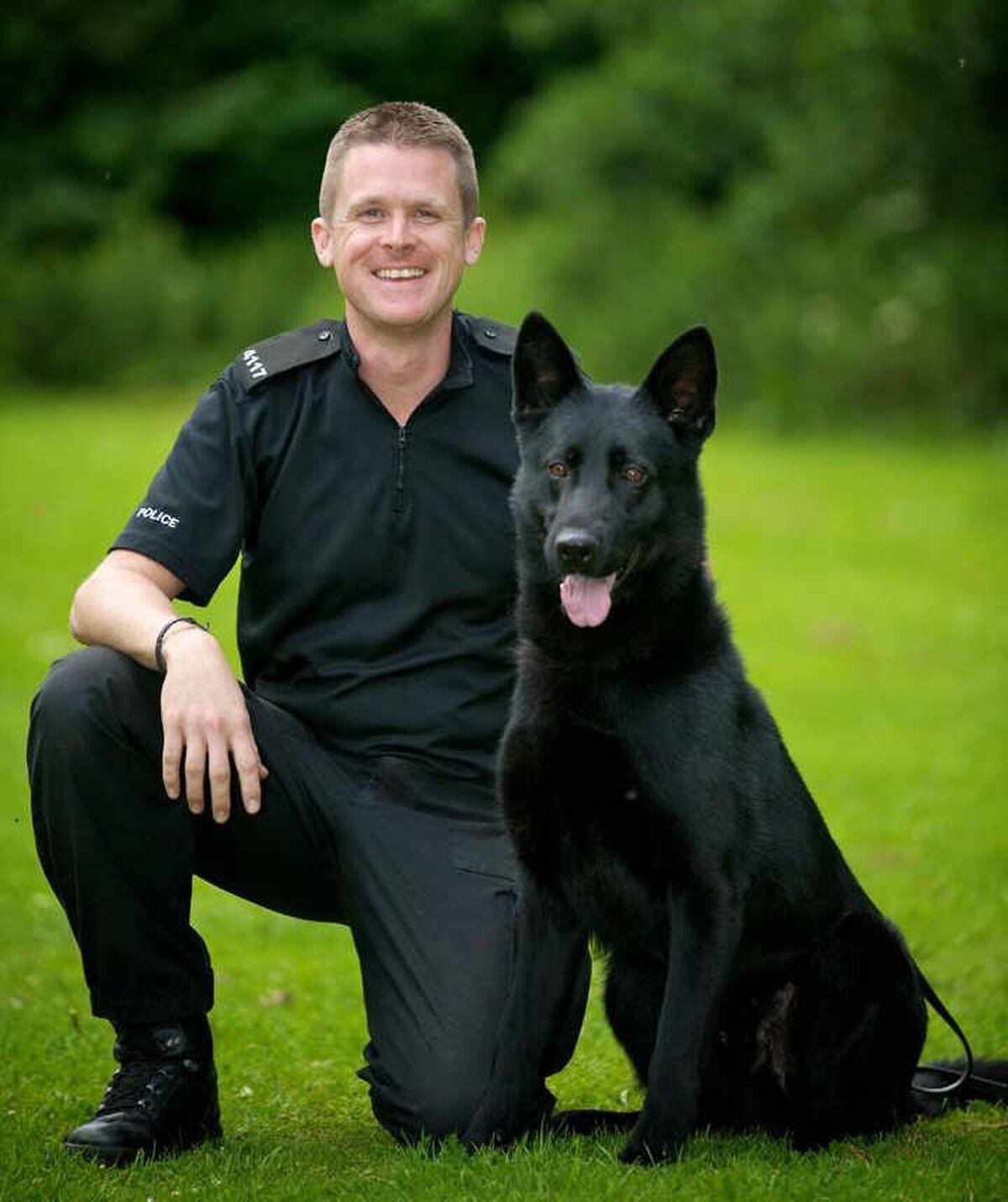Police dog Ska, who helped save a woman's life, with his handler Pc Keith Bennett