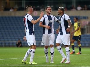 Karlan Grant of West Bromwich Albion celebrates after scoring a goal to make it 0-1 with Jed Wallace of West Bromwich Albion and John Swift of West Bromwich Albion at Kassam Stadium on July 19, 2022 in Oxford, England. (Photo by Adam Fradgley/West Bromwich Albion FC via Getty Images).
