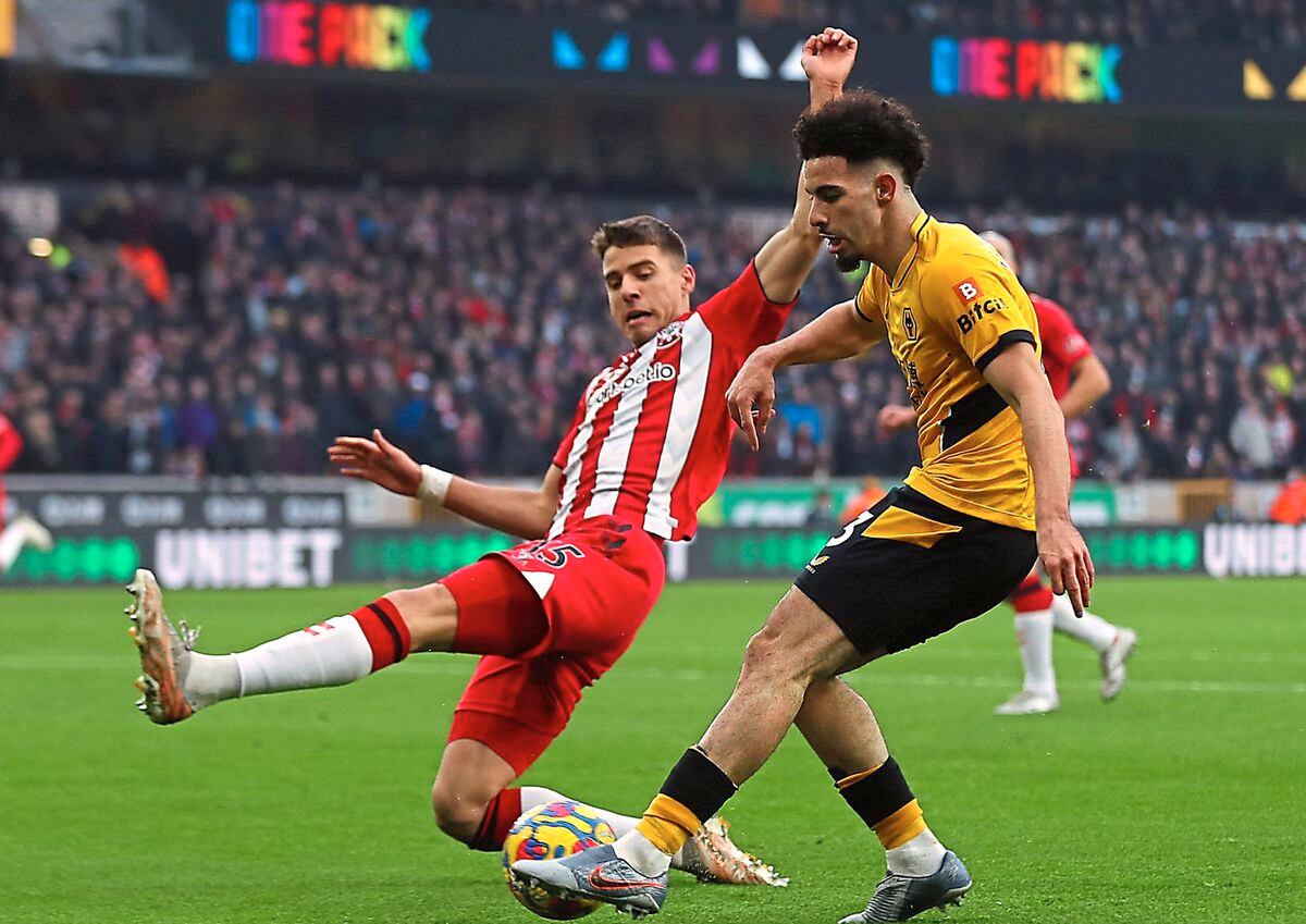 Rayan Ait-Nouri crosses under pressure from Southampton’s Jan Bednarek