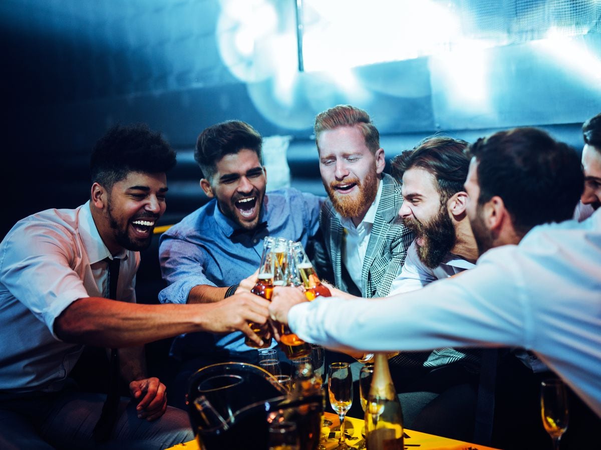Men toasting in the club