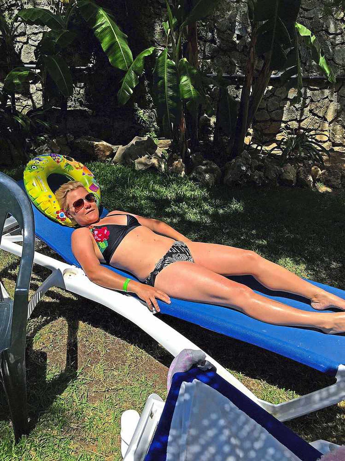 Rachael Green, 30, sunbathing before her health scare