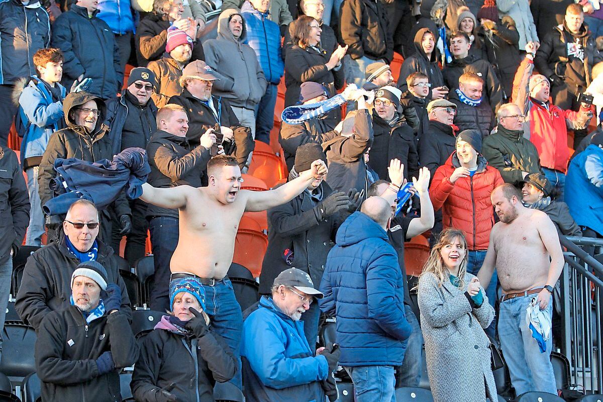 Halesowen Town fans are all smiles as their team shocked National League Barnet 2-1 to reach the FA Trophy semi-finals     Pic: Steve Evans