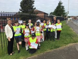The "PCSO Juniors" pictured with assistant head teacher Emma Mullett, Councillor Ruth Buttery, Councillor Cathryn Bayton and Councillor Khurshid Ahmed