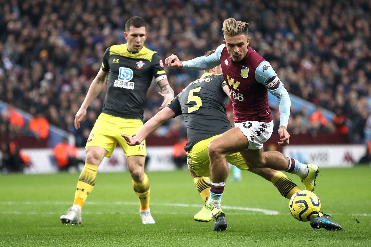 Southampton's Jack Stephens (centre) and Aston Villa's Jack Grealish (right) battle for the bal (Nick Potts/PA Wire)