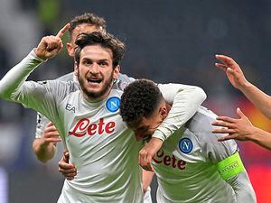 Napoli’s Giovanni Di Lorenzo, centre, celebrates after scoring his side’ssecond goal during the Champion League win over Eintracht Frankfurt