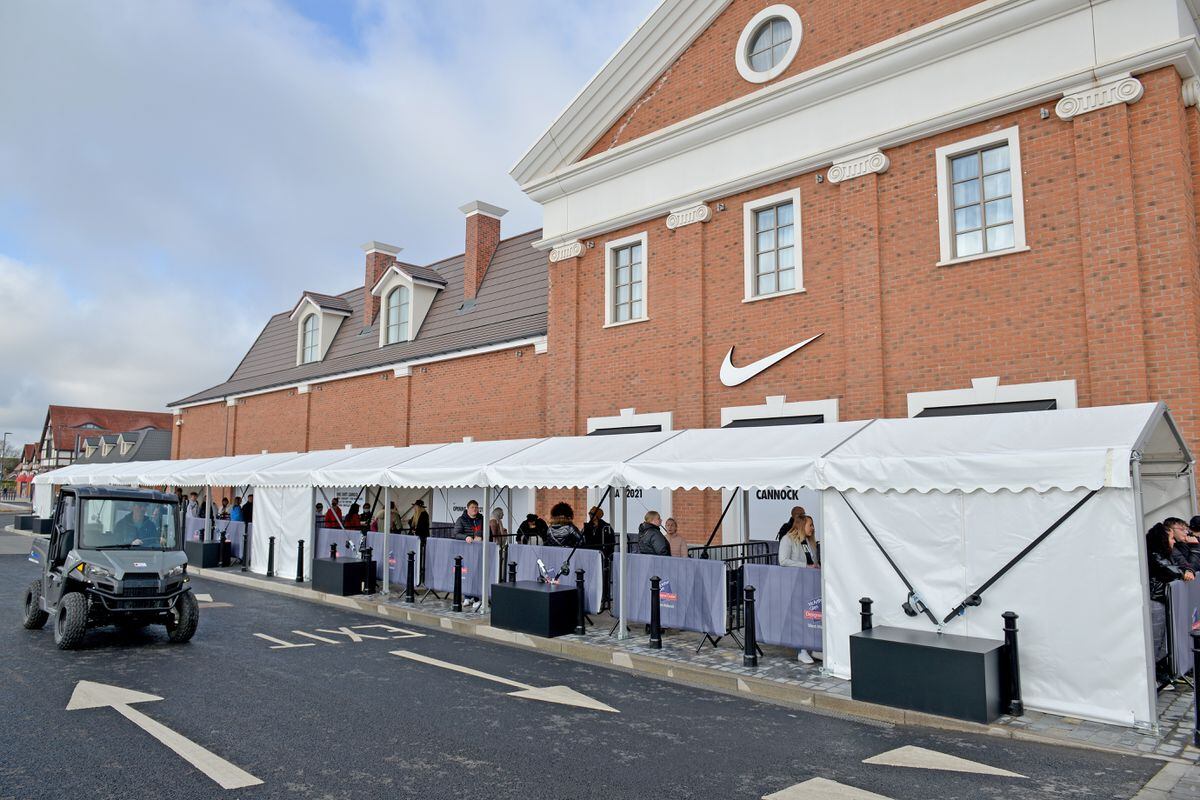 Shoppers arrive at the newly-opened designer outlet at Cannock