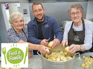 Good Shepherd chief executive Tom Hayden chips in helping in the kitchen with volunteers Elsie Hawthorne and Pam Smith