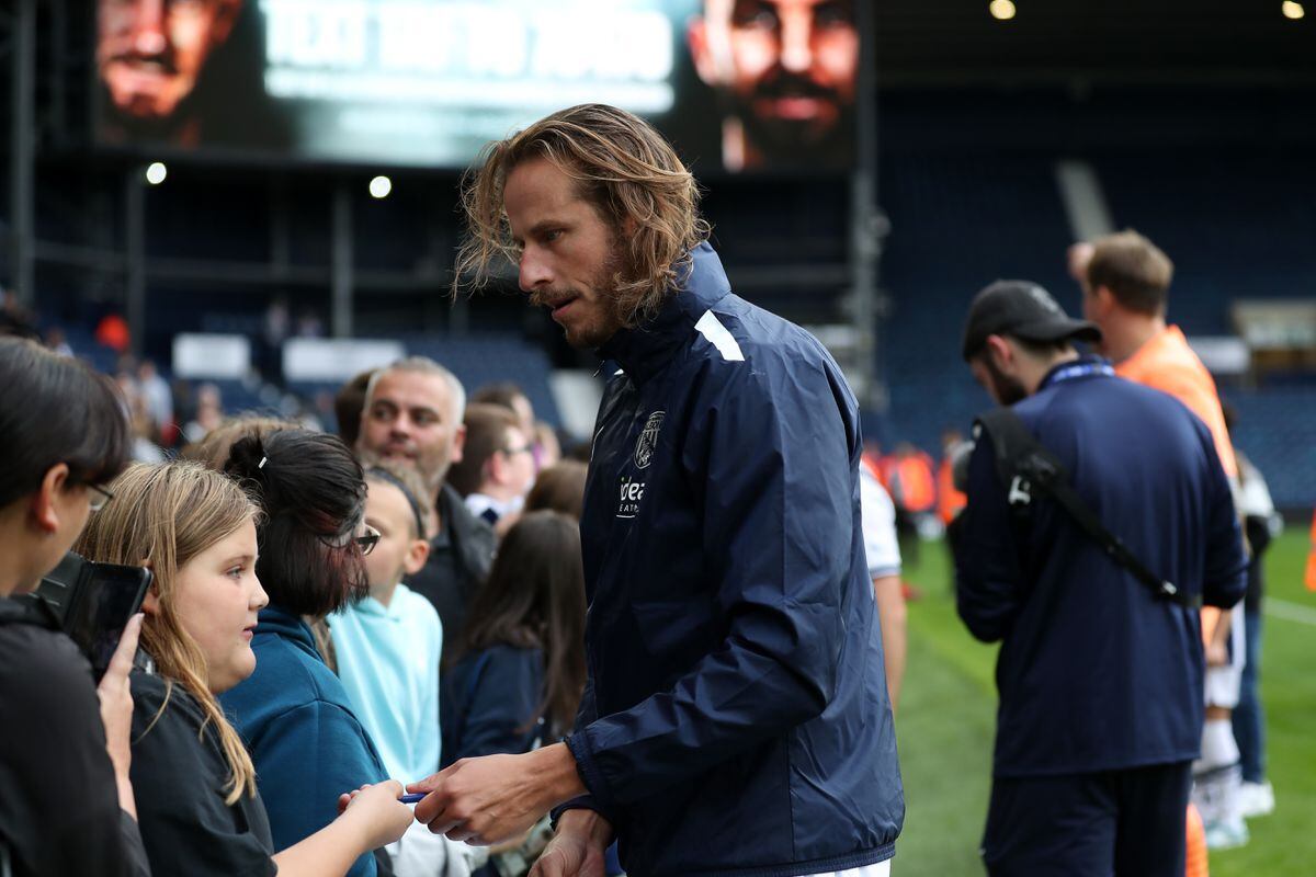  Jonas Olsson poses for selfies and signs autographs for fans after the match at The Hawthorns on September 24, 2022 in West Bromwich, England. (Photo by Adam Fradgley/West Bromwich Albion FC via Getty Images).