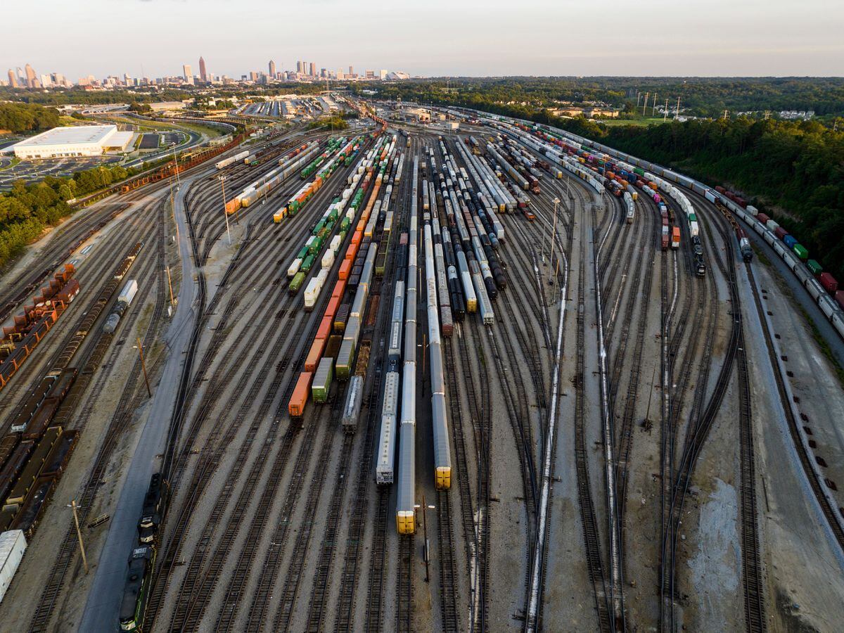 Freight train cars sit in a Norfolk Southern rail yard