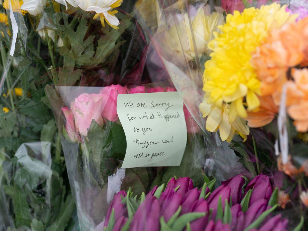 Flowers at the scene on Broadlands, Netherfield, Milton Keynes, Buckinghamshire, where a four-year-old girl has died following reports of a dog attack in the back garden of a property (Joe Giddens/PA)