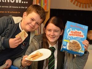 Enjoying breakfast at a new free breakfast club are Declan Hunt, aged 11, and Keeley Glover, aged 13 