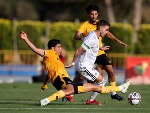 BENIDORM, SPAIN - JULY 23: Raul Jimenez of Wolverhampton Wanderers challenges Tyler Boyd of Besiktas during the Pre-Season Friendly Match between Besiktas and Wolverhampton Wanderers at Estadio Camilo Cano on July 23, 2022 in Benidorm, Spain. (Photo by Jack Thomas - WWFC/Wolves via Getty Images).