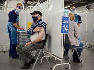 Mass vaccination centre opens at Millennium Point, Birmingham. Pictured, Ken Hughes, ages 82, from Swindon, gets the jab