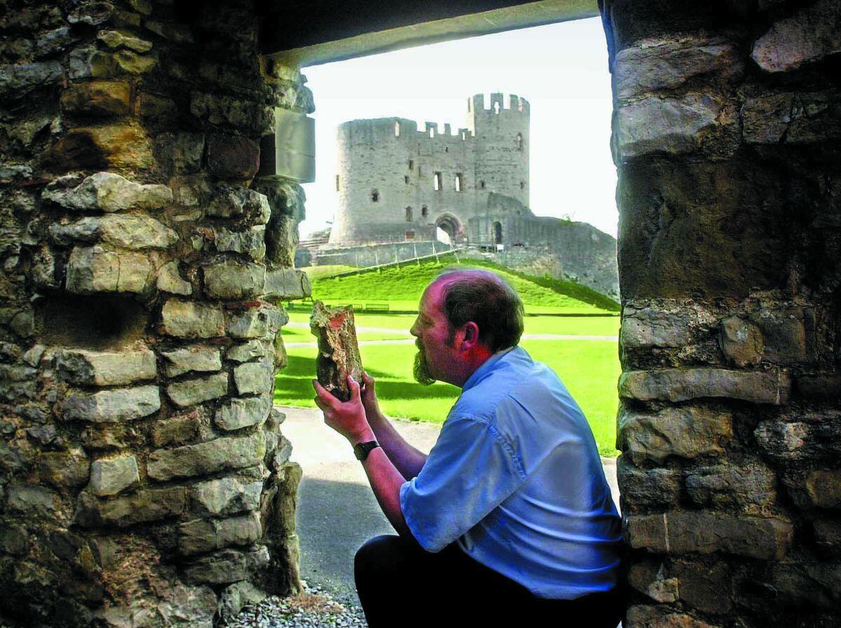Adrian Durkin examines a brick which fell from Dudley Castle during the earthquake on the night of September 22, 2002