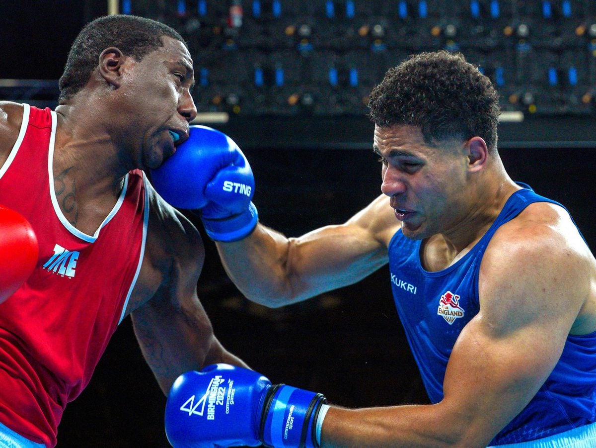 England's Delicious Orie (Blue) and Trinidad and Tobago's Nigel Paul (Red) compete in the Men's Super Heavy (+92) Quarter Final at The NEC on day seven of the 2022 Commonwealth Games in Birmingham. Picture date: Thursday August 4, 2022. PA Photo. See PA story COMMONWEALTH Boxing. Photo credit should read: Peter Byrne/PA Wire...RESTRICTIONS: Use subject to restrictions. Editorial use only, no commercial use without prior consent from rights holder..