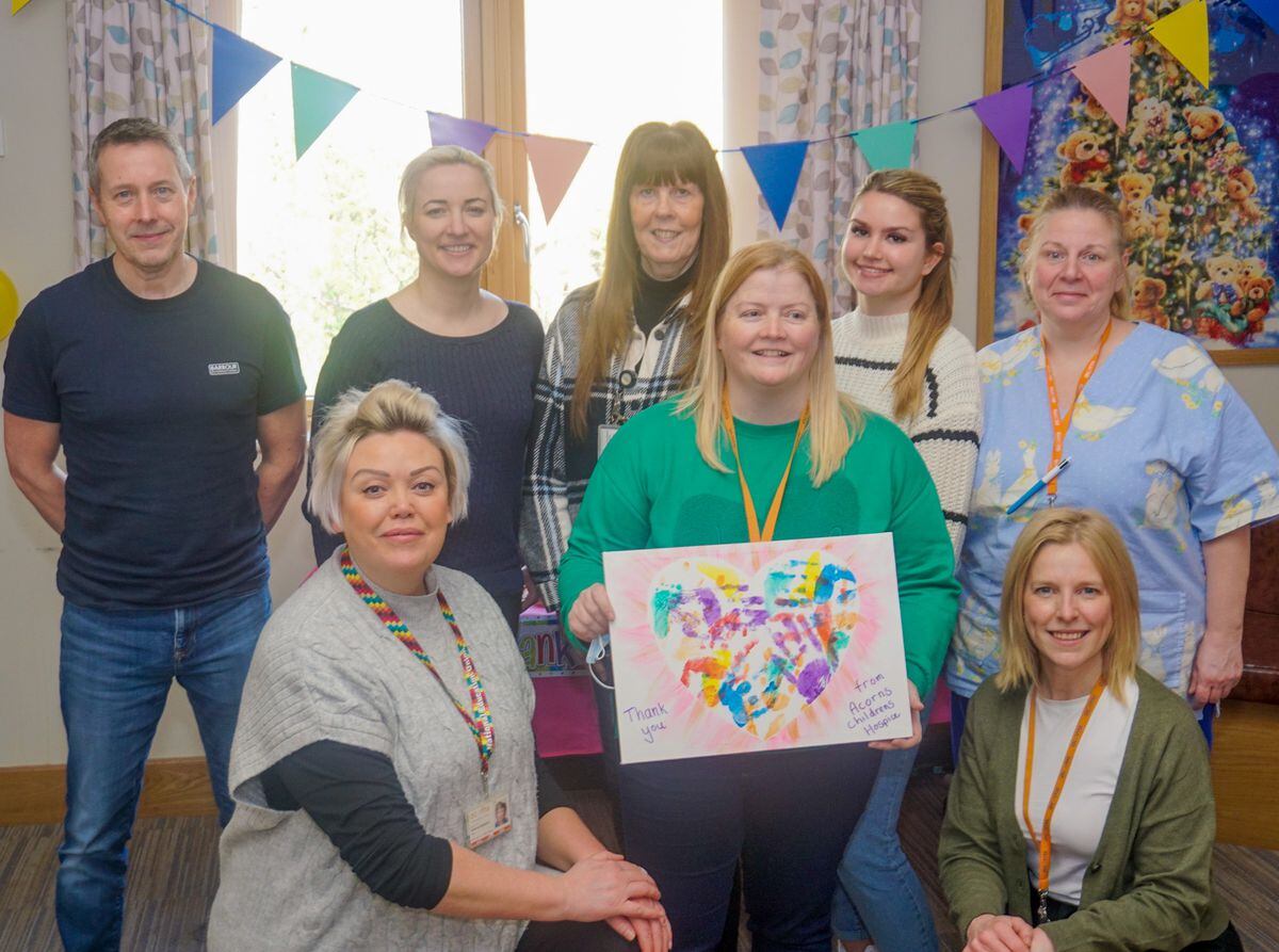 Staff gathered from both hospices to celebrate the partnership