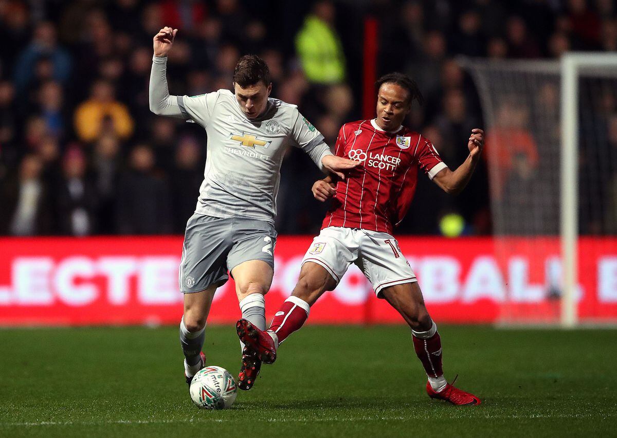 Bristol City's Bobby Reid (right) in action with Manchester United's Victor Lindelof last season