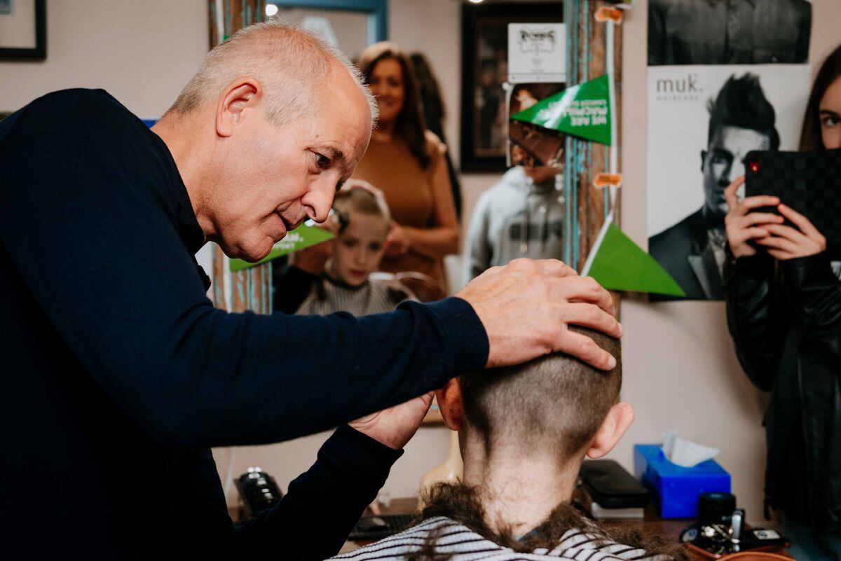 Ryan Peters from Wolverhampton braves the shave for MacMillan as his grandad has recently been diagnosed with cancer and is undergoing treatment. He has his head shaved at Raymond's Barbershop in Wolverhampton by Steve Bull