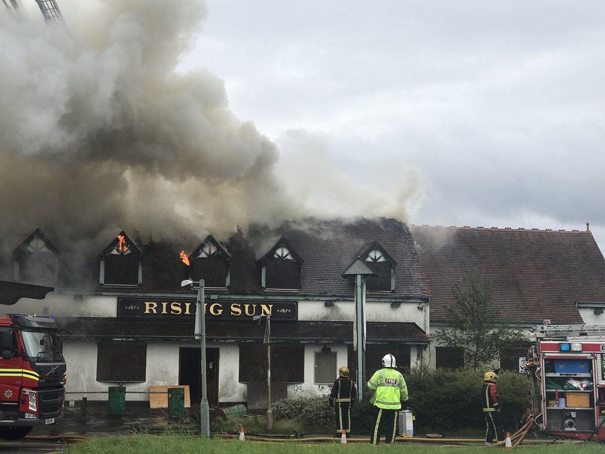 Flames burst from The Rising Sun pub, on the A5 Chester Road, during a fire last October. Picture: Burntwood&Chase CFR
