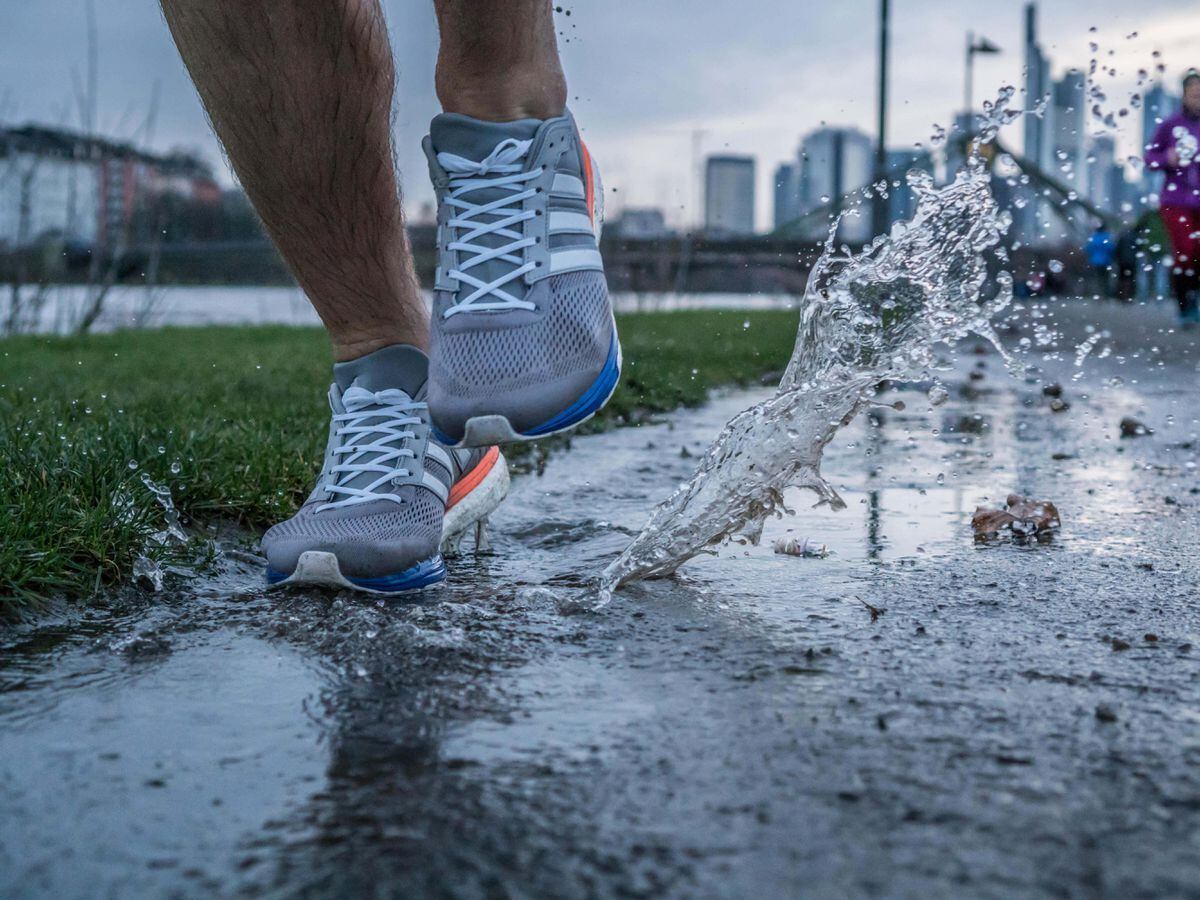 A person running through puddles