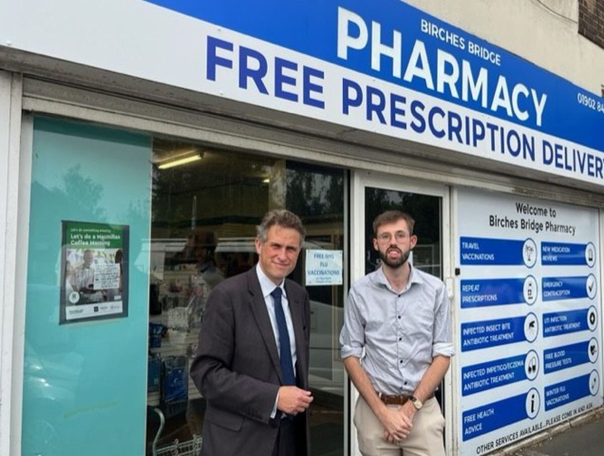 Sir Gavin Williamson with pharmacist James Laycock