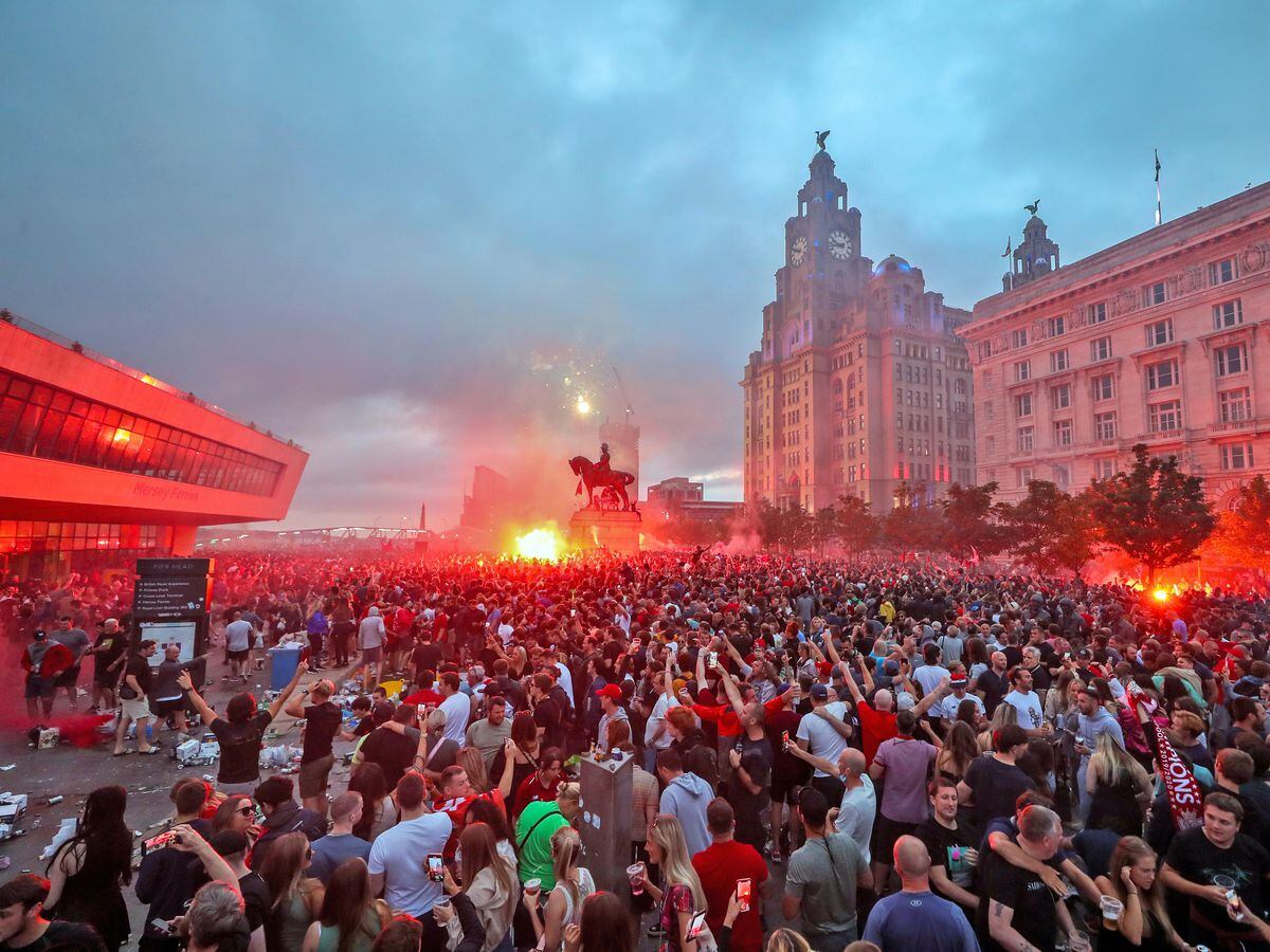 Liverpool FC condemns fans' behaviour as Liver Building burns amid ...