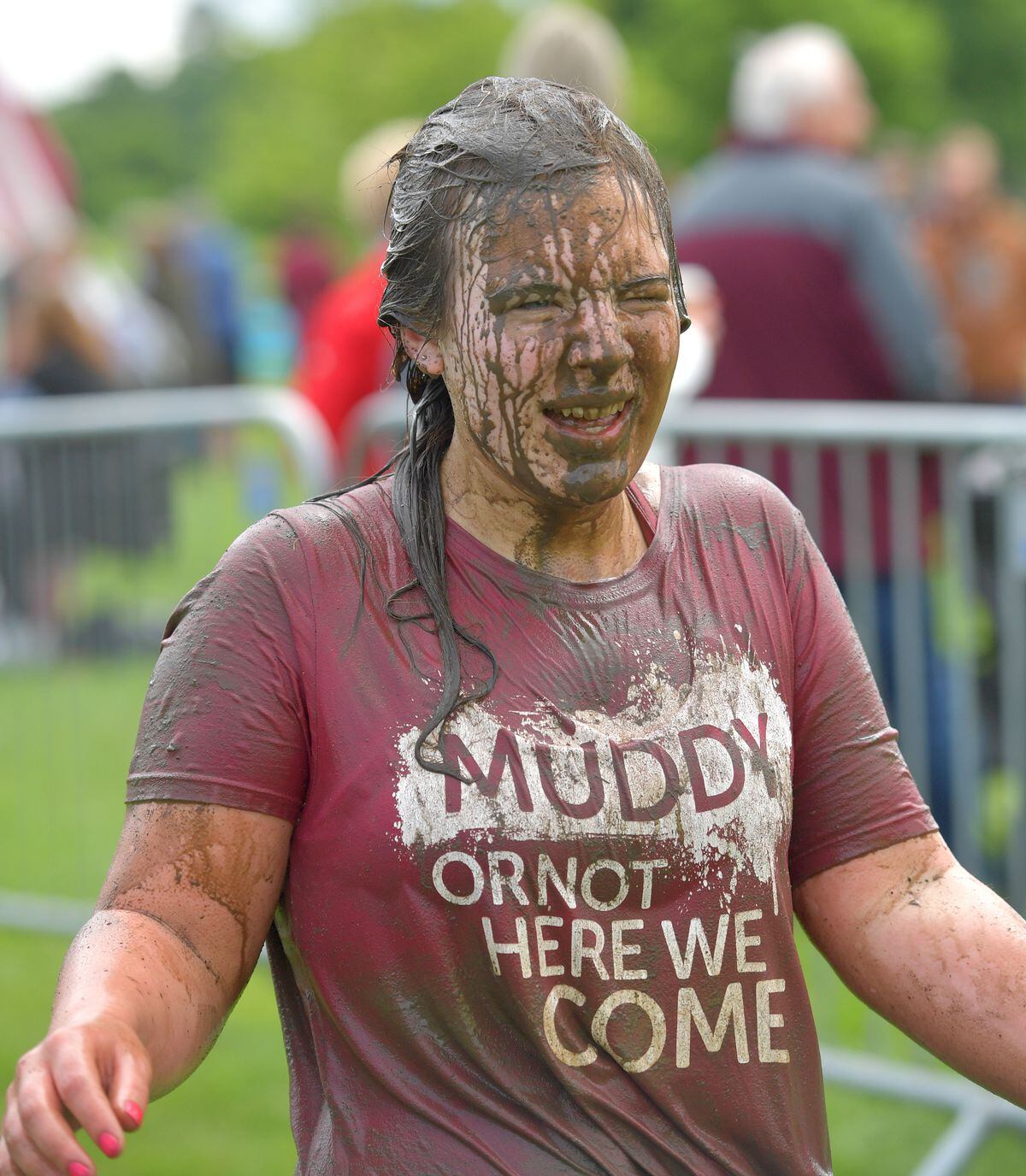 Charlotte Hadwen from Telford crosses the finish line at Pretty Muddy