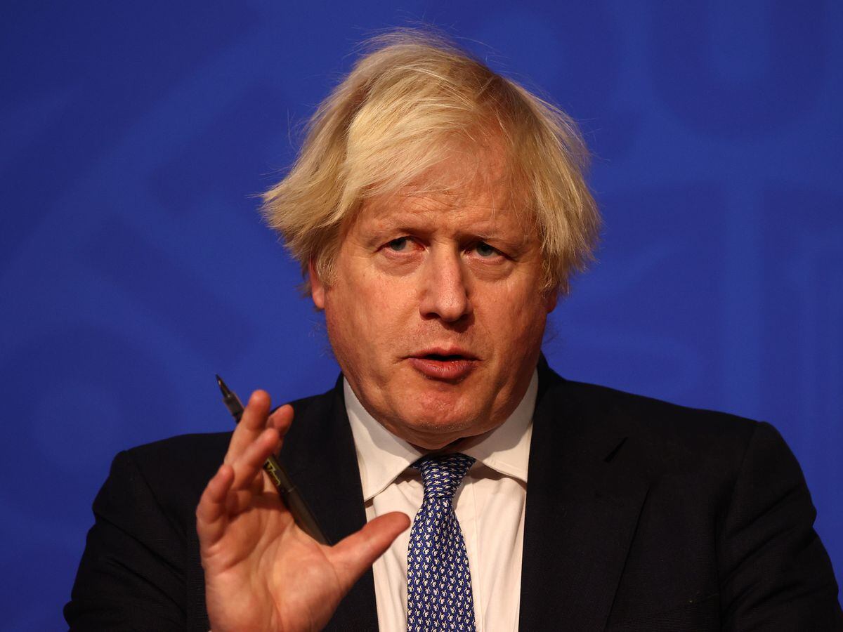 Prime Minister Boris Johnson speaking at a press conference in Londonâs Downing Street after ministers met to consider imposing new restrictions in response to rising cases and the spread of the Omicron variant