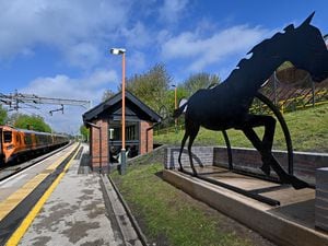 DUDLEY COPYRIGHT MNA MEDIA TIM THURSFIELD 28/04/23.Volunteers who helped to restore the black horse monument celebrate as it has now been returned to it's rightful place at Coseley Railway Station...
