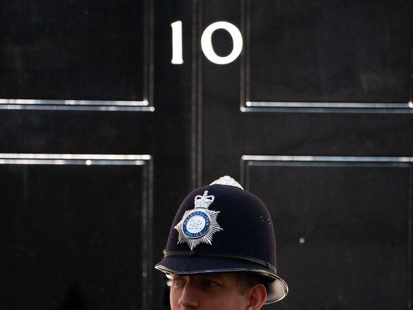 A Metropolitan Police officer stands outside 10 Downing Street, Westminster, London. Photo: Dominic Lipinski/PA Wire