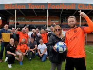 Bilston Town FC. Standing at the front are team captain Aaron Weston and club chair Denise Frankham