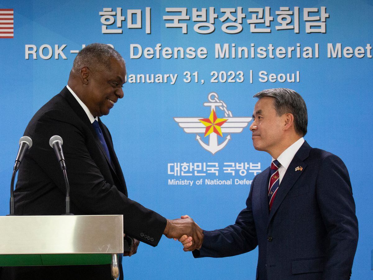 US Defence Secretary Lloyd Austin shakes hands with South Korean Defence Minister Lee Jong-sup
