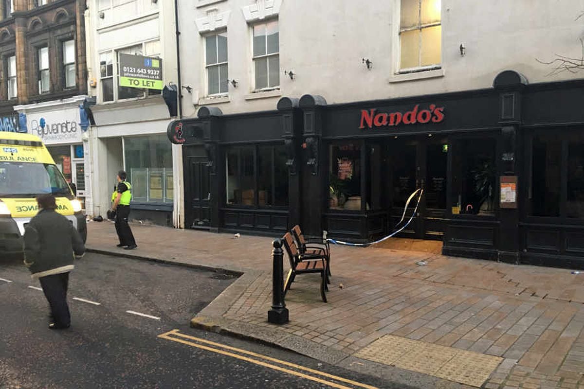 An ambulance was parked outside Nando's