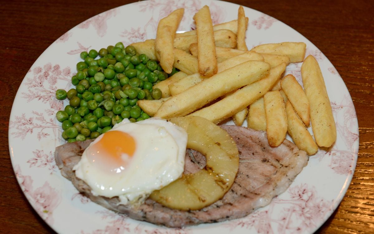 Steak out – the gammon was served with a free-range fried egg, pineapple, chips and peas                                                                              Pictures by John Sambrooks
