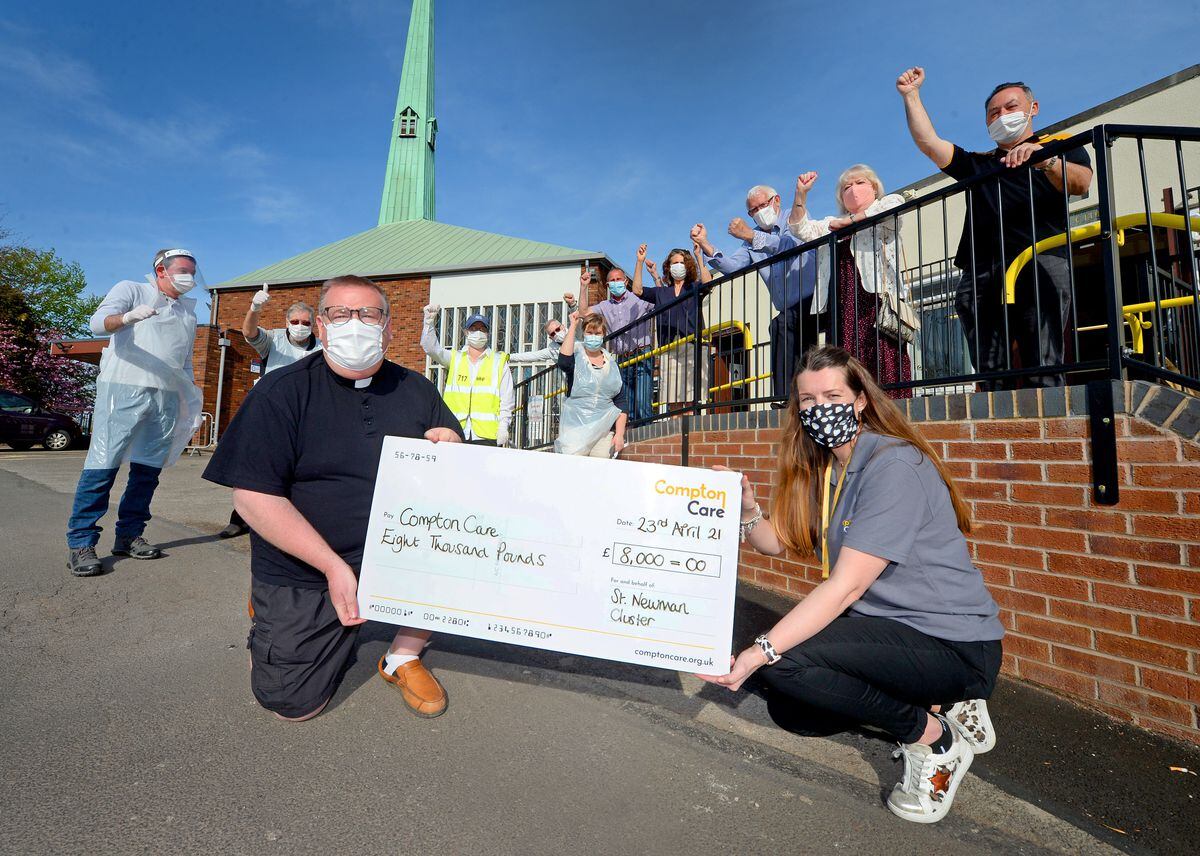 Father Craig Fullard hands over a cheque for £8,000 to Kate Kelly from Compton Care. Money was given to the church per test and a percentage of each was put together, with a donation being made to Compton Care
