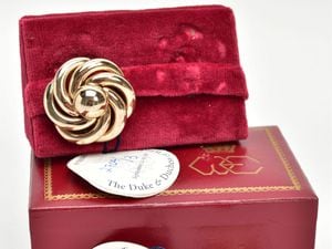  The pair of Bergere gold-plated clip on earrings, in a red and gilt case with an interlinked WE – for Wallis and Edward – below a coronet