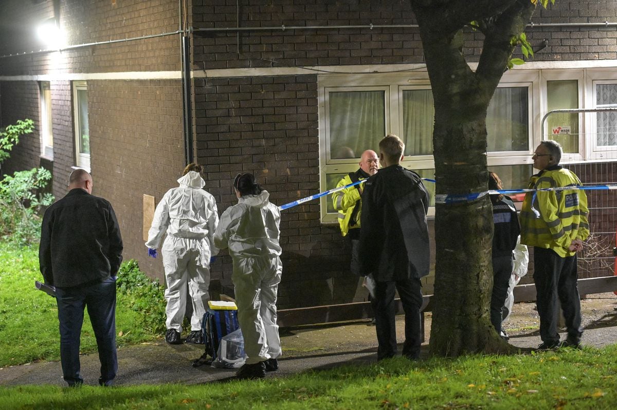 Police at the scene in Heath Town after the man's body was found. Photo: SnapperSK