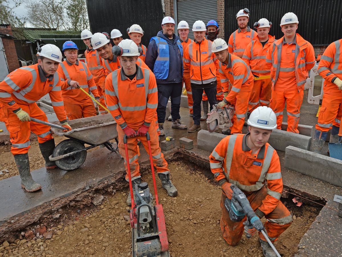 SANDWELL COPYRIGHT TIM STURGESS EXPRESS AND STAR 30/03/2023.Sandwell college training centre, Phoenix street, West Bromwich. Pre pic for training  open day. Pictured centre ( in blue) is Highways lecturer Dean Rodwell and right Allan Davies from Doocey Ltd..