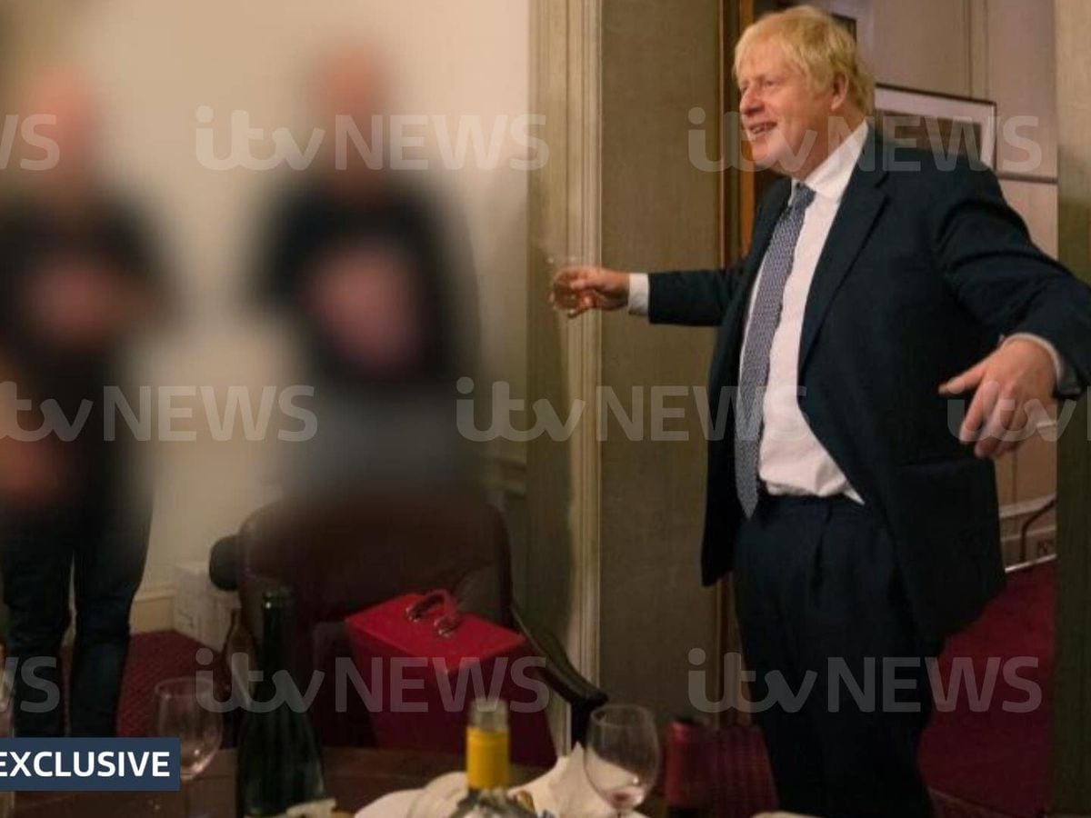 A photograph obtained by ITV News of the Prime Minister raising a glass at a leaving party