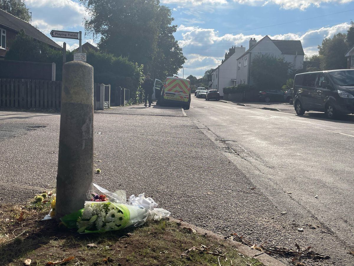 Floral tributes outside a property in Main Street, Stonnall, Staffordshire