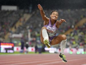 Jazmin Sawyers, of Great Britain, makes an attempt in the Women's long jump final during the athletics competition in the Olympic Stadium at the European Championships in Munich, Germany, Thursday, Aug. 18, 2022. (AP Photo/Matthias Schrader).