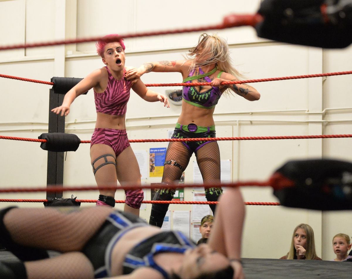 Hannah Taylor lays a shot in on Harley Hudson as Lucia Lee lies out of the way