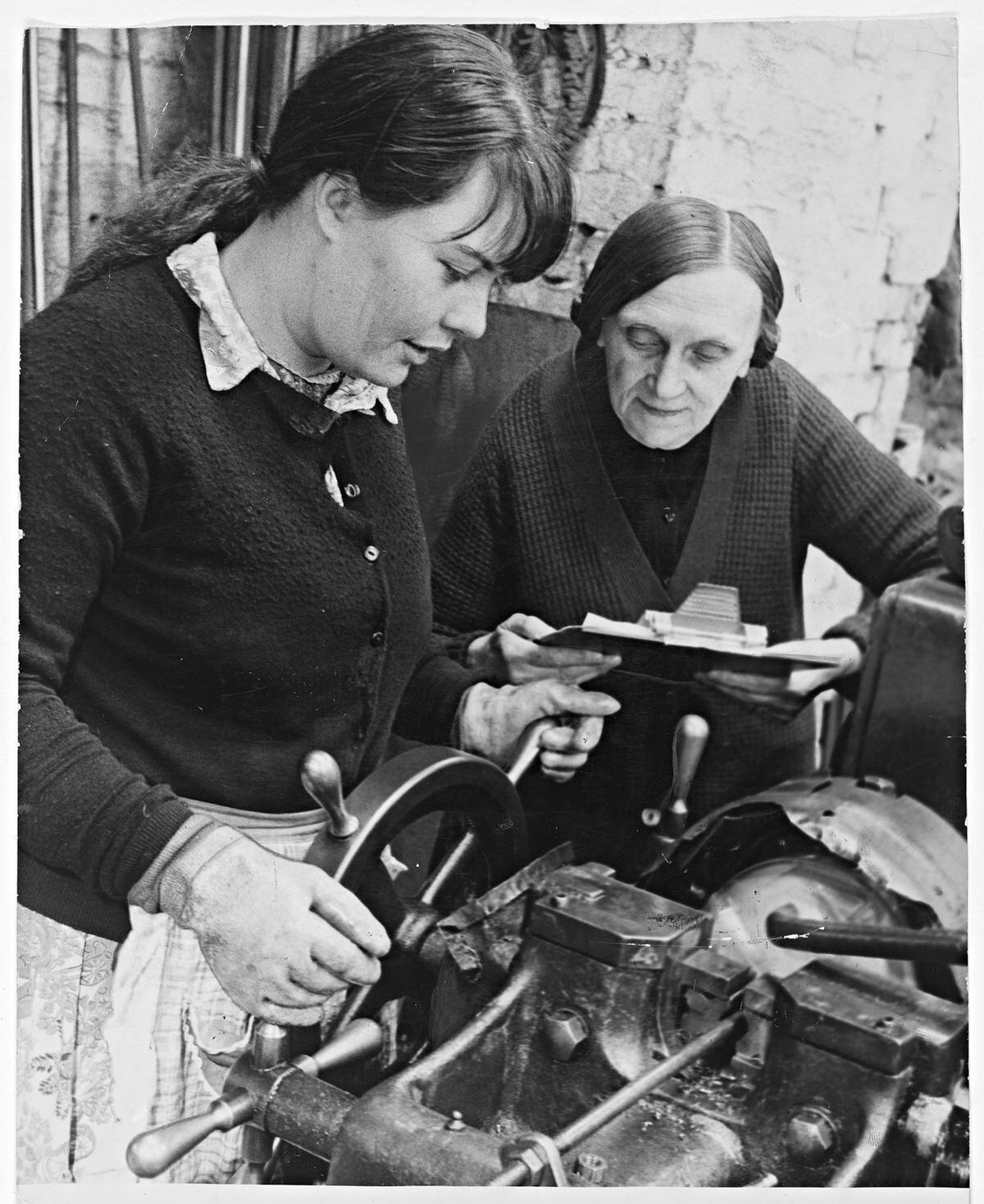 July 22, 1970: Family blacksmiths, Joseph Wyle & Co. in Blackheath was established in 1860. Photograph shows Ellen Beese teaching her daughter Elizabeth as the firm adapted to 20th century techniques – going metric.