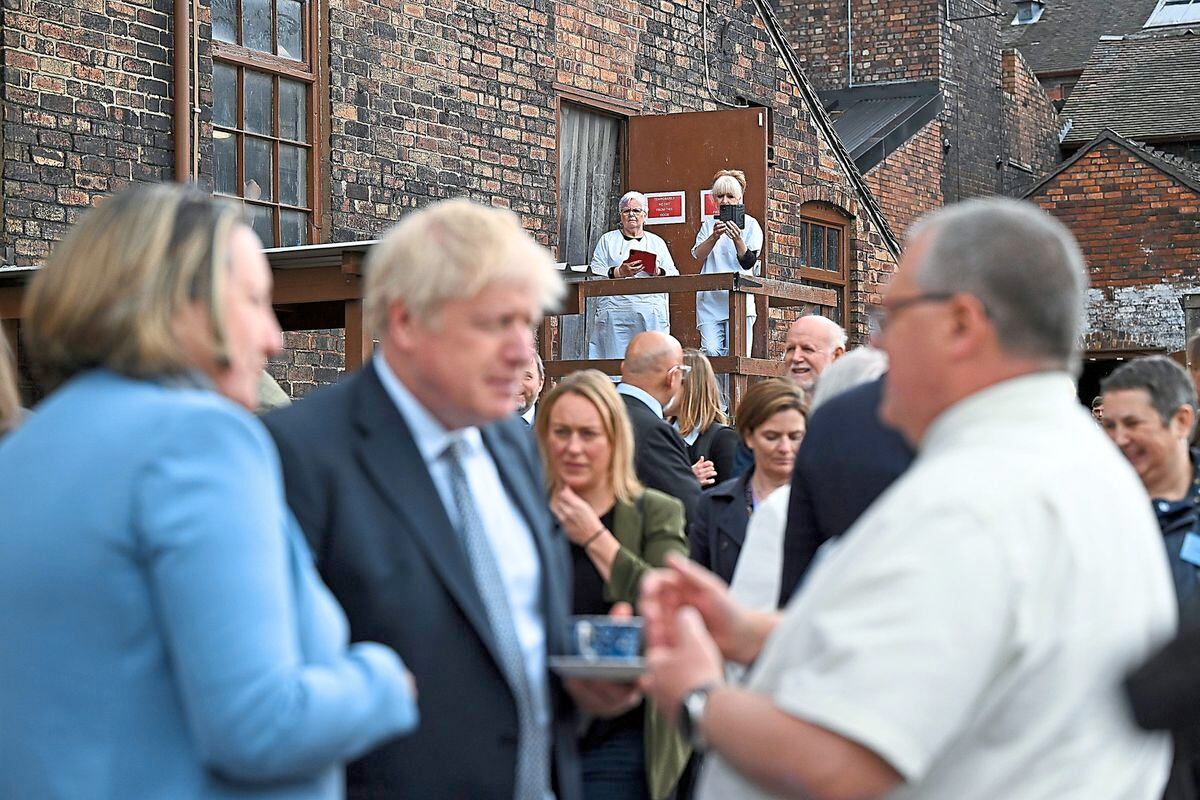 International Trade Secretary Anne-Marie Trevelyan and Prime Minister Boris Johnson talking to local business people after a regional cabinet meeting at Middleport Pottery in Stoke-on-Trent 