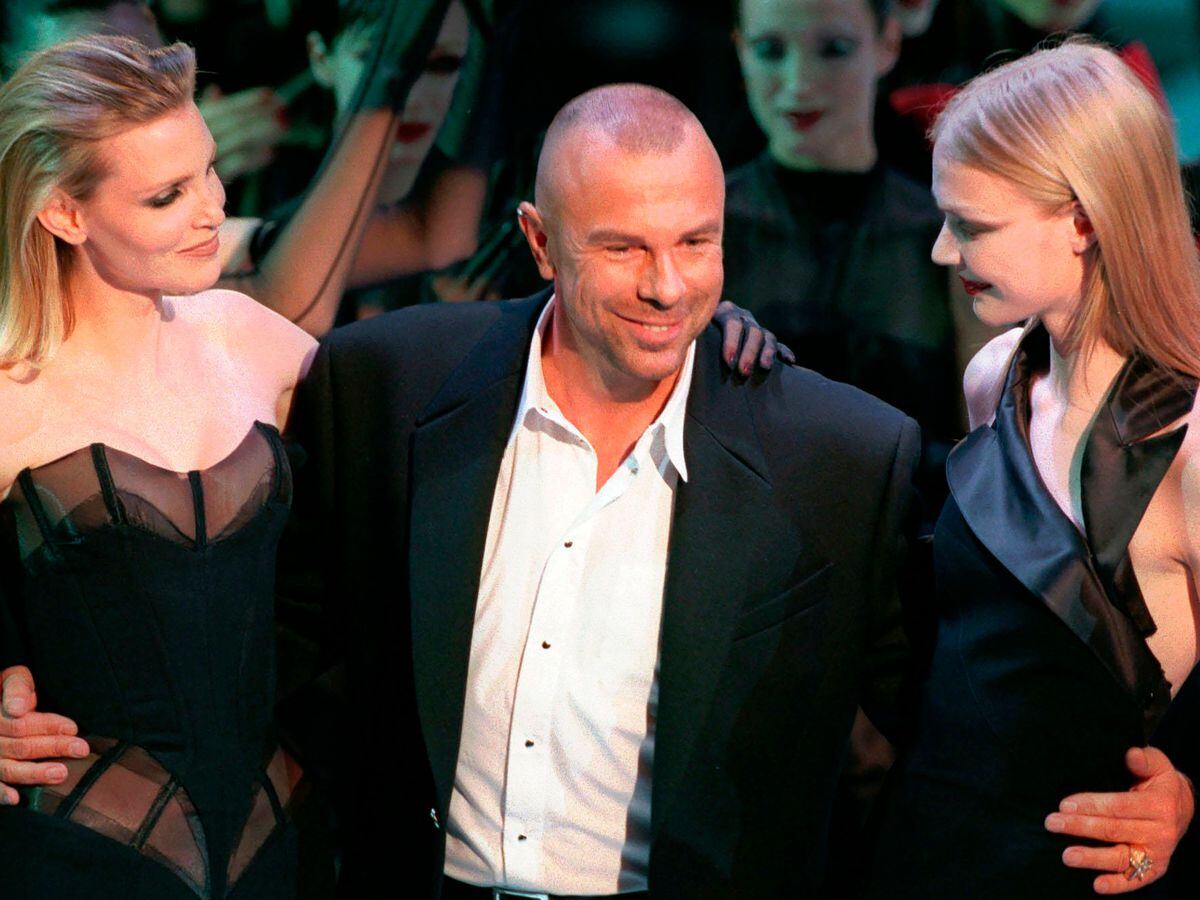 French fashion designer Thierry Mugler on the catwalk with unidentified models (Remy de la Mauviniere/AP)