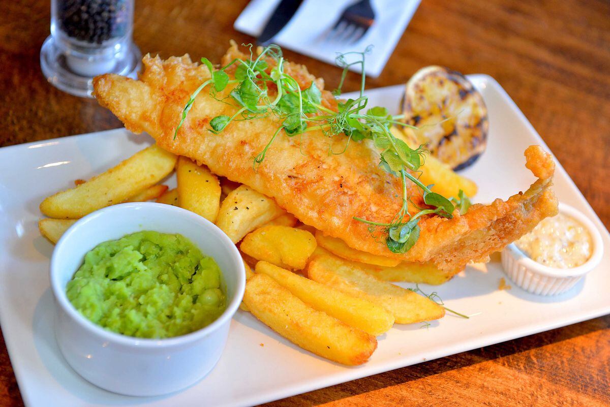 Beer-battered cod with triple-cooked chips, mushy peas and tartare sauce