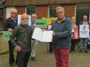 Phillip Oliver from the Wyre Forest Friends of the Earth, handing over the petition letter to MP Mark Garnier