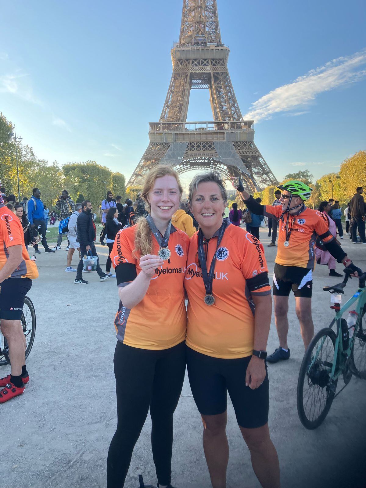 Deb at the finish line, in front of the Eiffel Tower, with her niece and fellow rider Flis O’Toole
